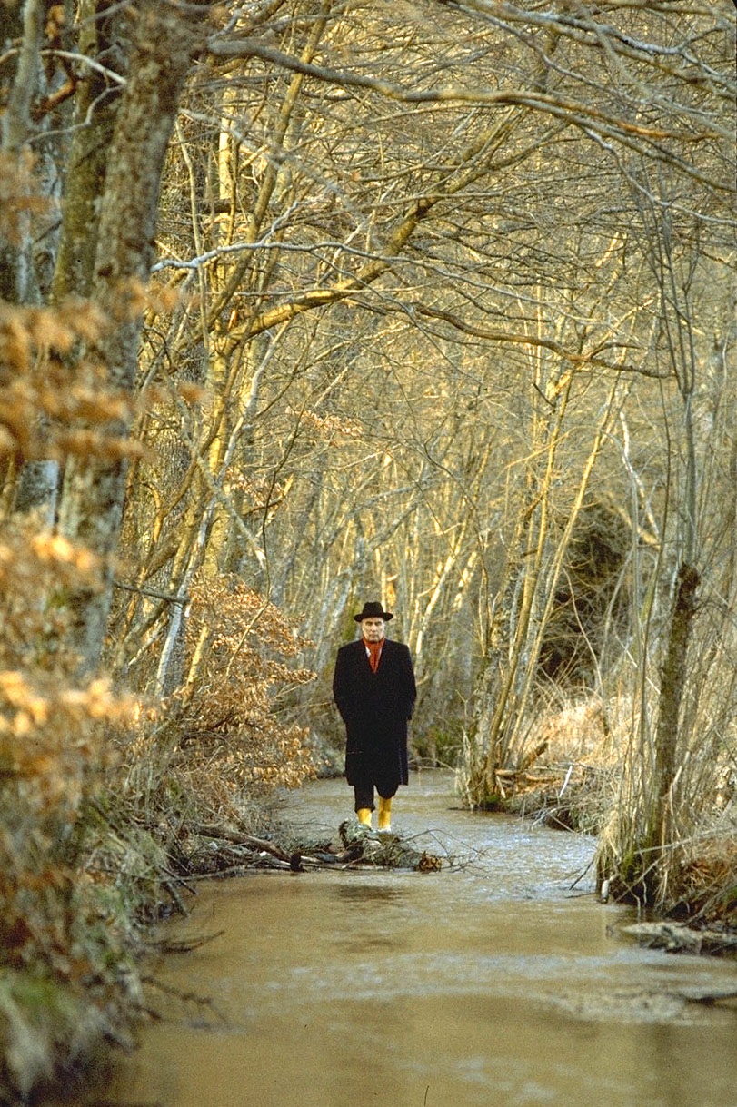  President Mitterand walking in the forest near Chateau Chinon. 