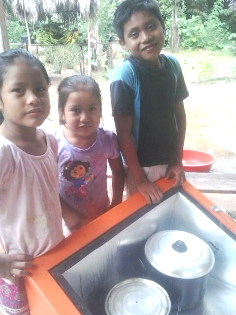 The children with the new solar oven