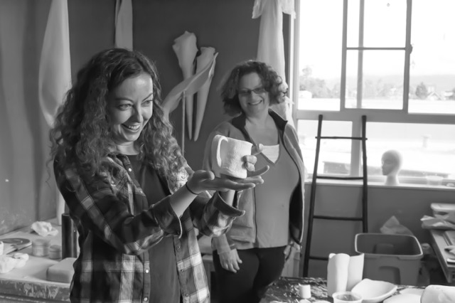 Two lovely students of mine enjoying what they made in porcelain.