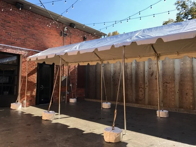 Open-air marquee tent connects the Front Room and Ballroom in the Courtyard.