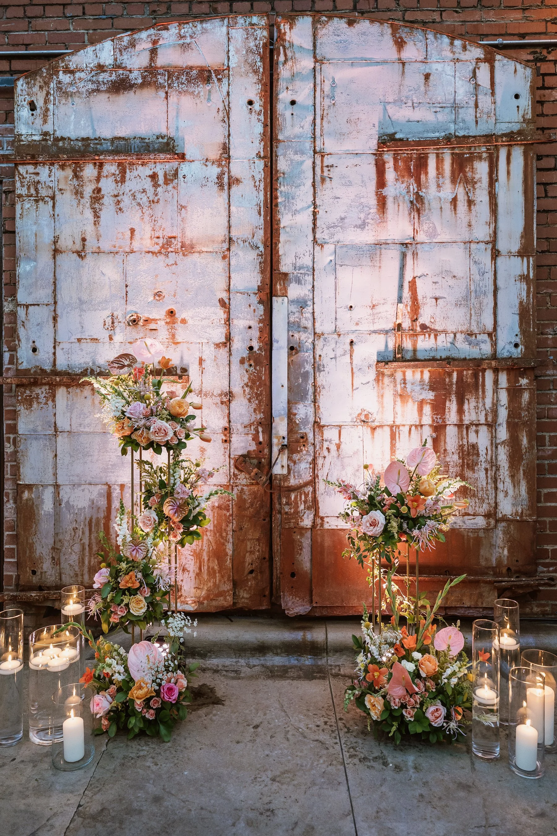 Industrial style metal doors backdrop for wedding ceremony