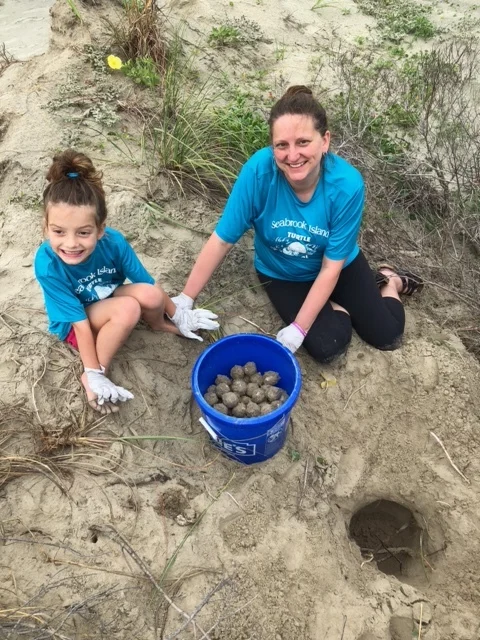 Rachael and Neva Carter helping relocate the nest