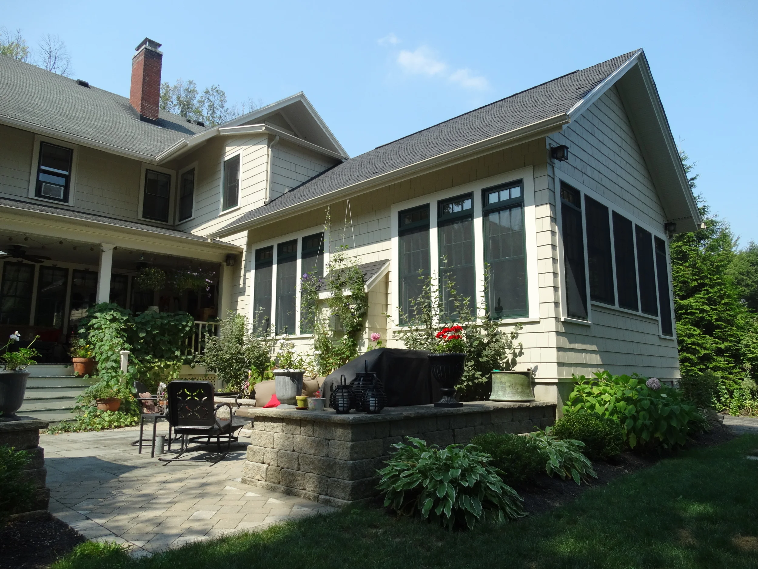 The transition to this kitchen/family room addition helps to define the optimal outdoor entertaining space while offering essential family areas for gatherings inside. 