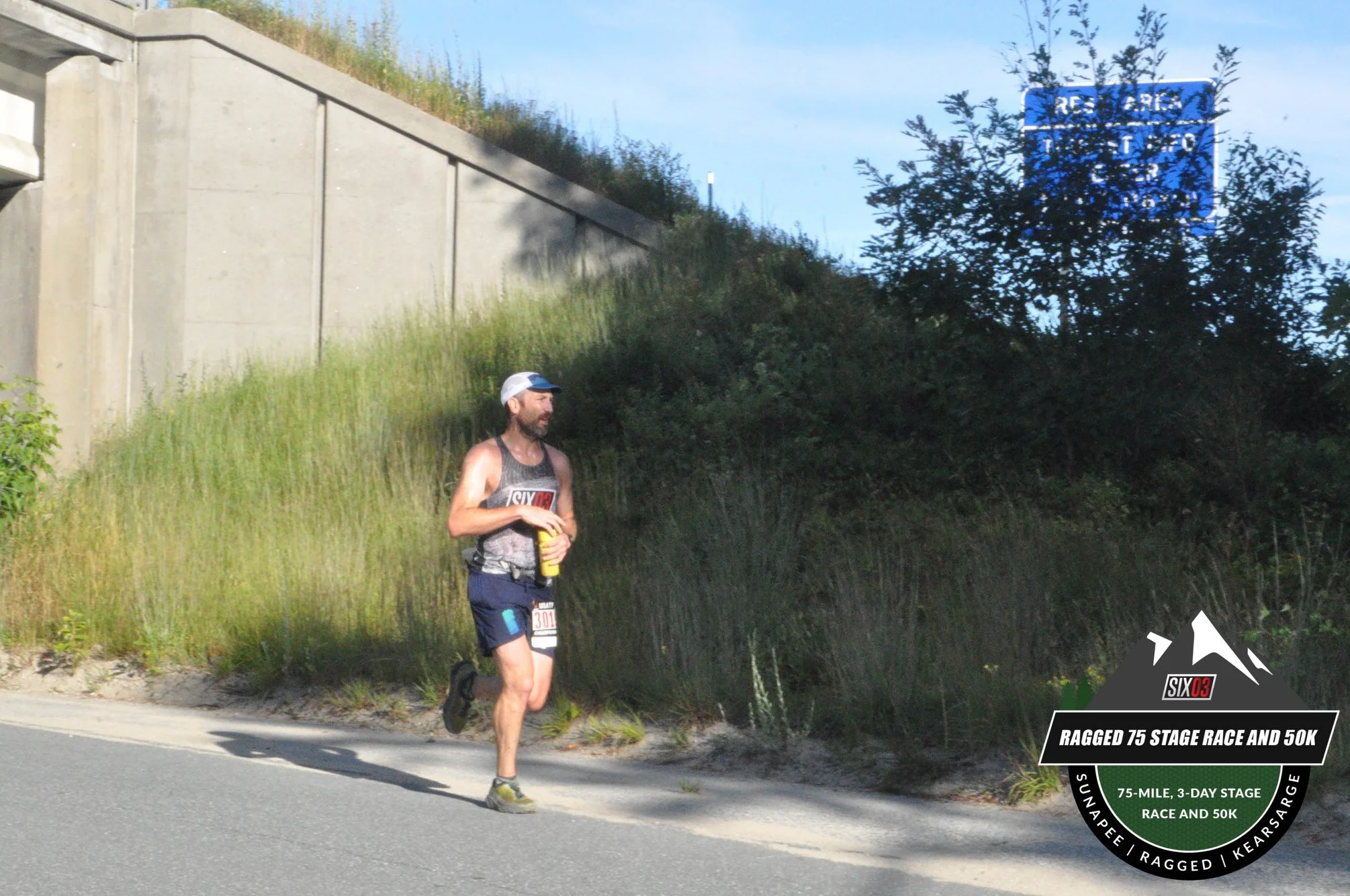 Rolling through the first aid station (mile 6) - mostly roads up to this point and already feeling it.