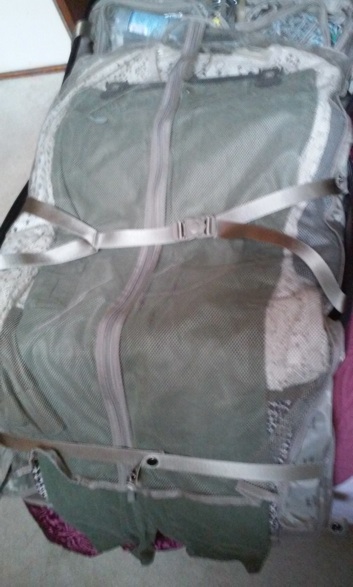 Outfits stacked (and hung, since my client's suitcase has a hanger trolley), flat in the carryon.