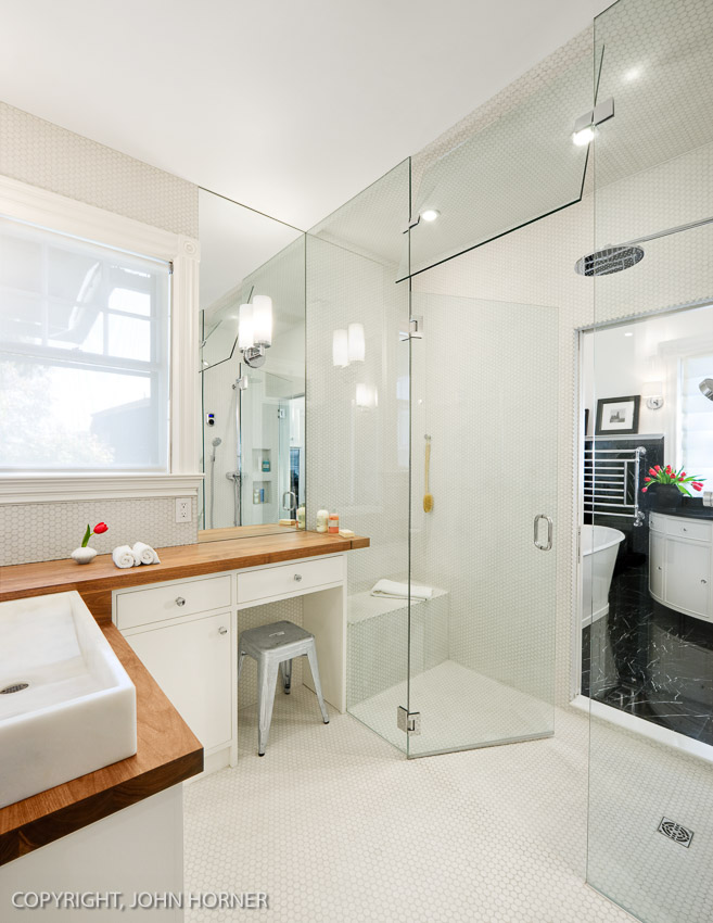 Two bathroom renovations with shared central shower