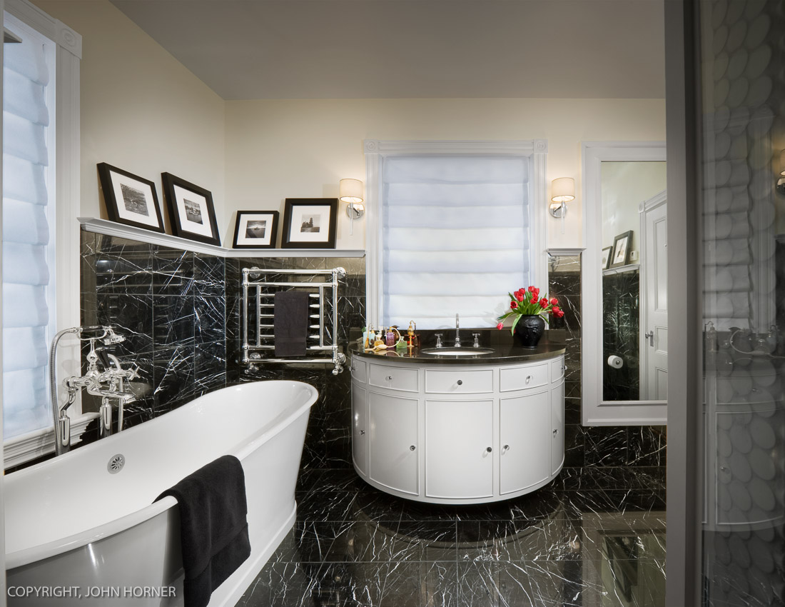  Master bathroom with custom round vanity. 