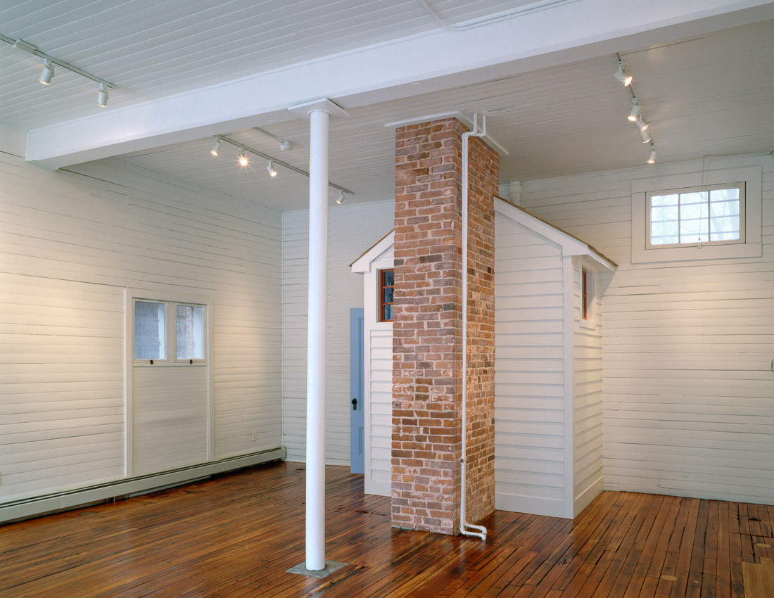  Renovated office space in 1870s carriage house. 