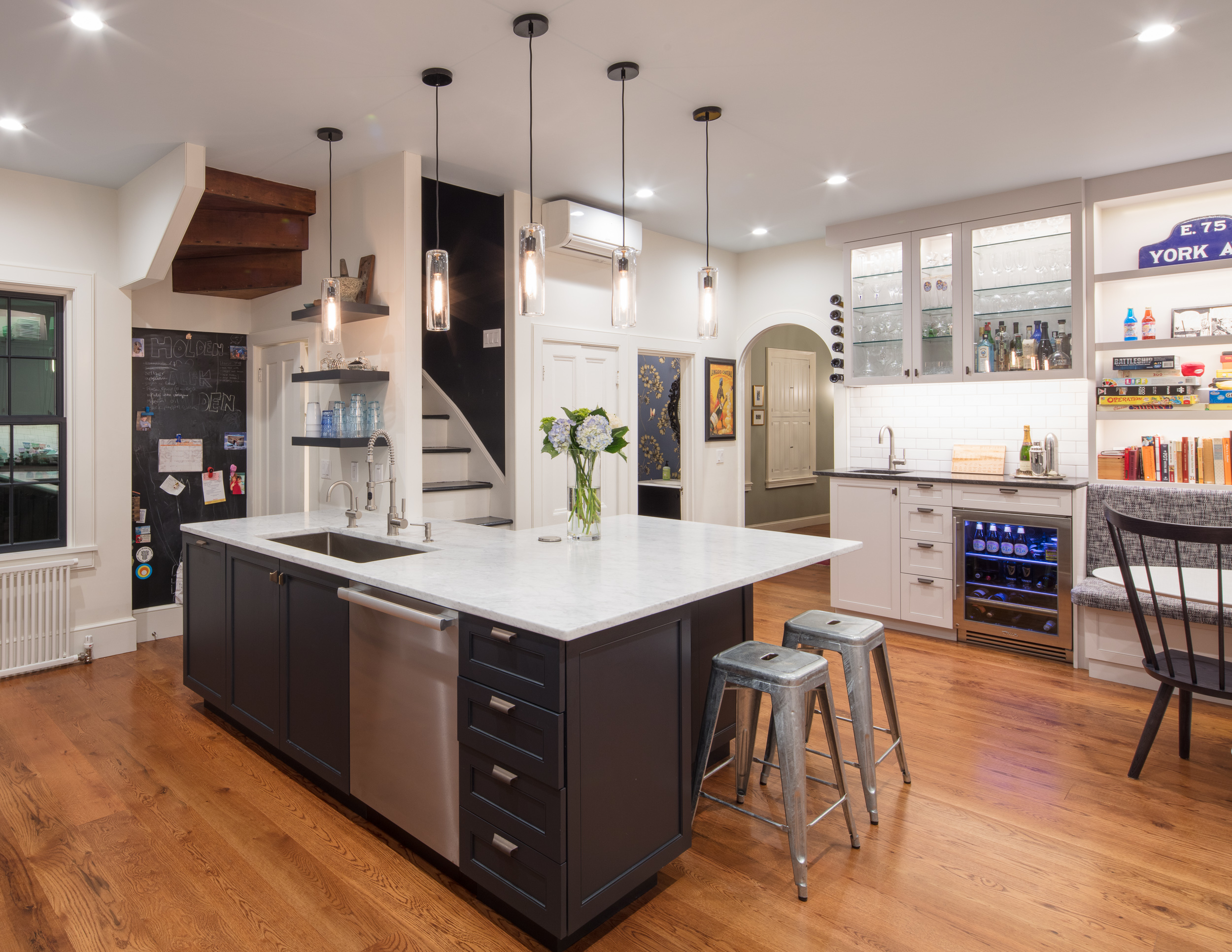  Kitchen renovation with an 8-foot addition and a black and white design. 