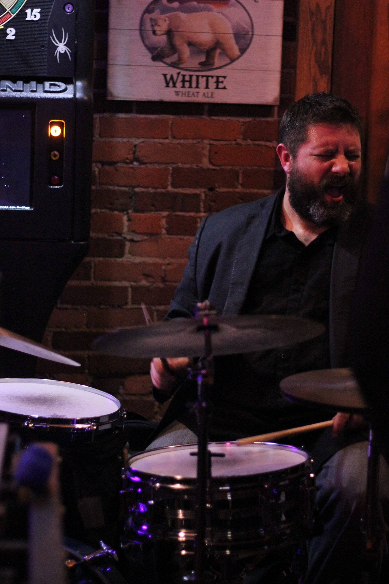 John Kizilarmut, either really invested in the music or yawning, at our most recent gig together at Firehouse in Eau Claire, WI. Photo credit: Greta Lozada