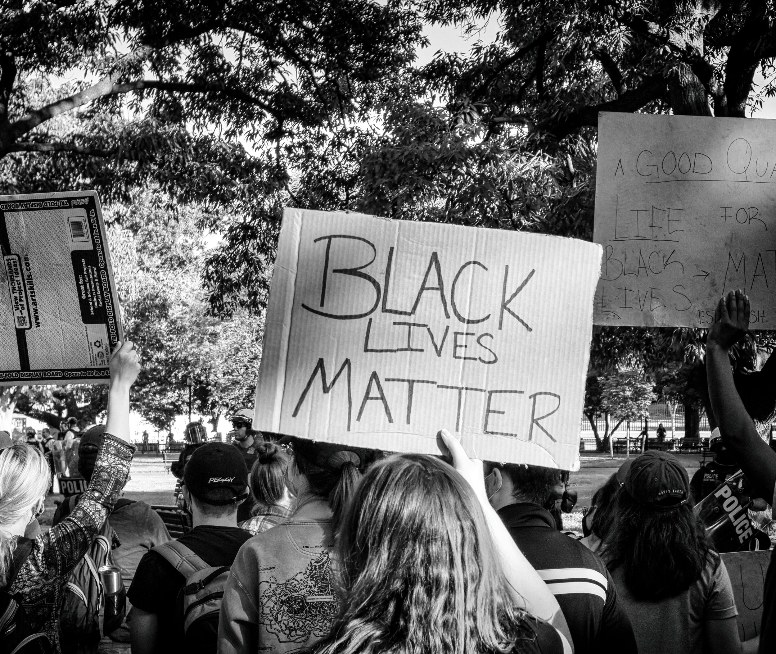black and white photo of a sign that says black lives matter