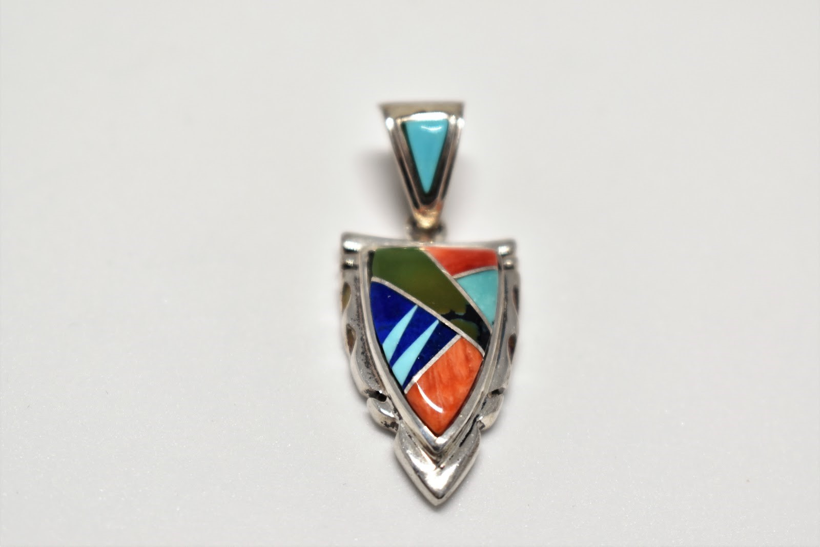 small multi inlay arrowhead pendant.jpg