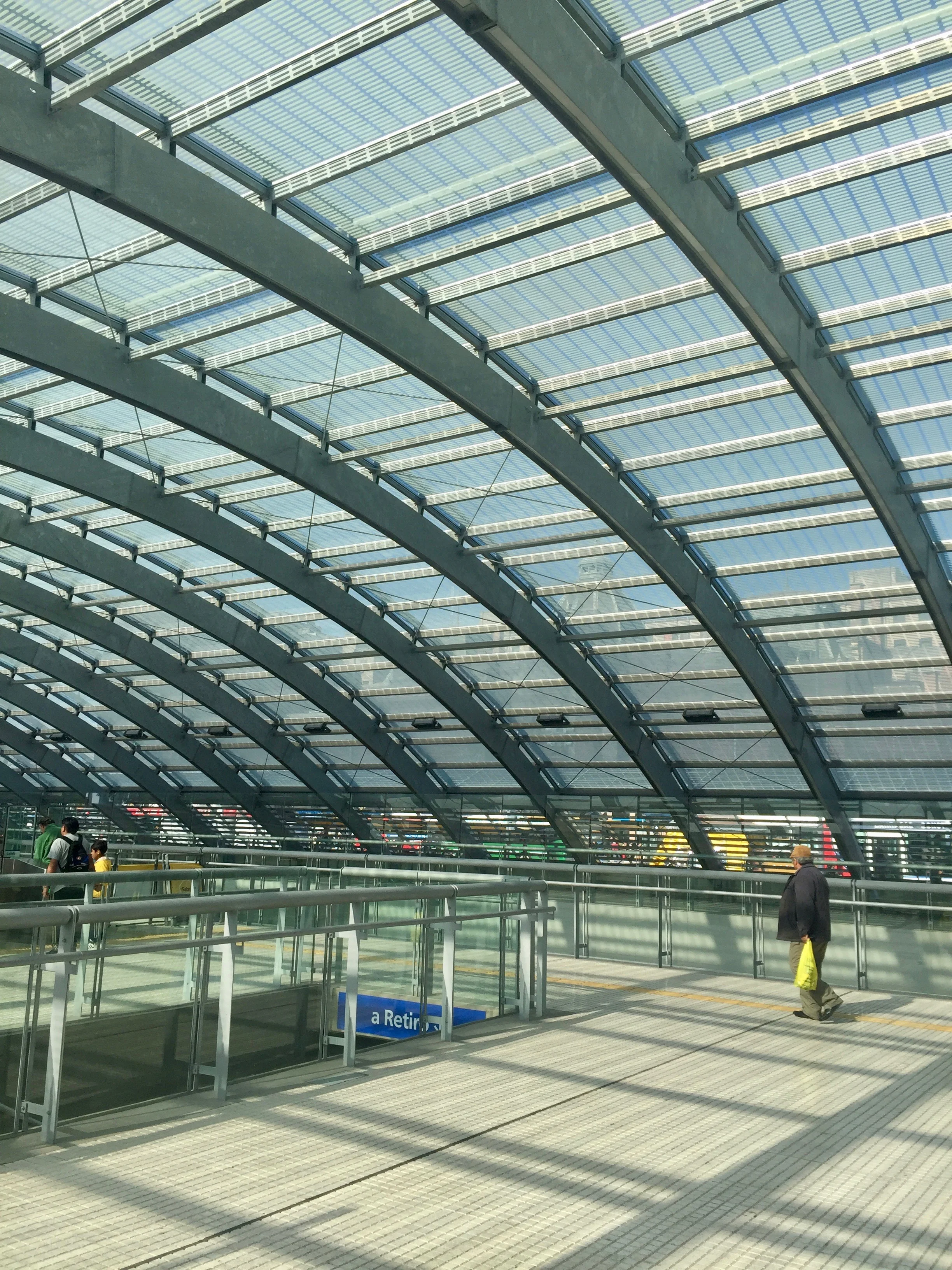 Above and below: two above-ground train station entrances