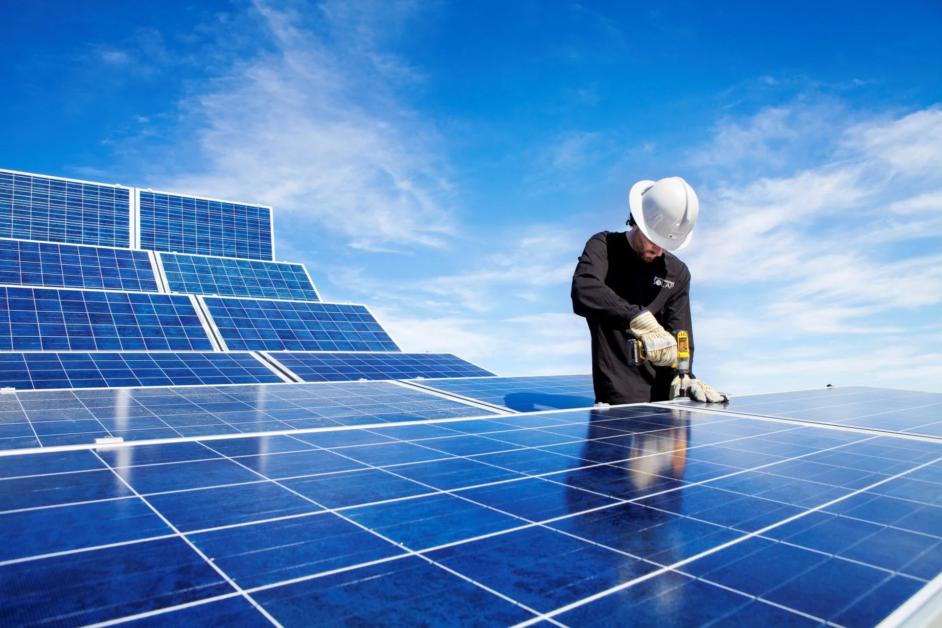 A NAIT student installing a solar array