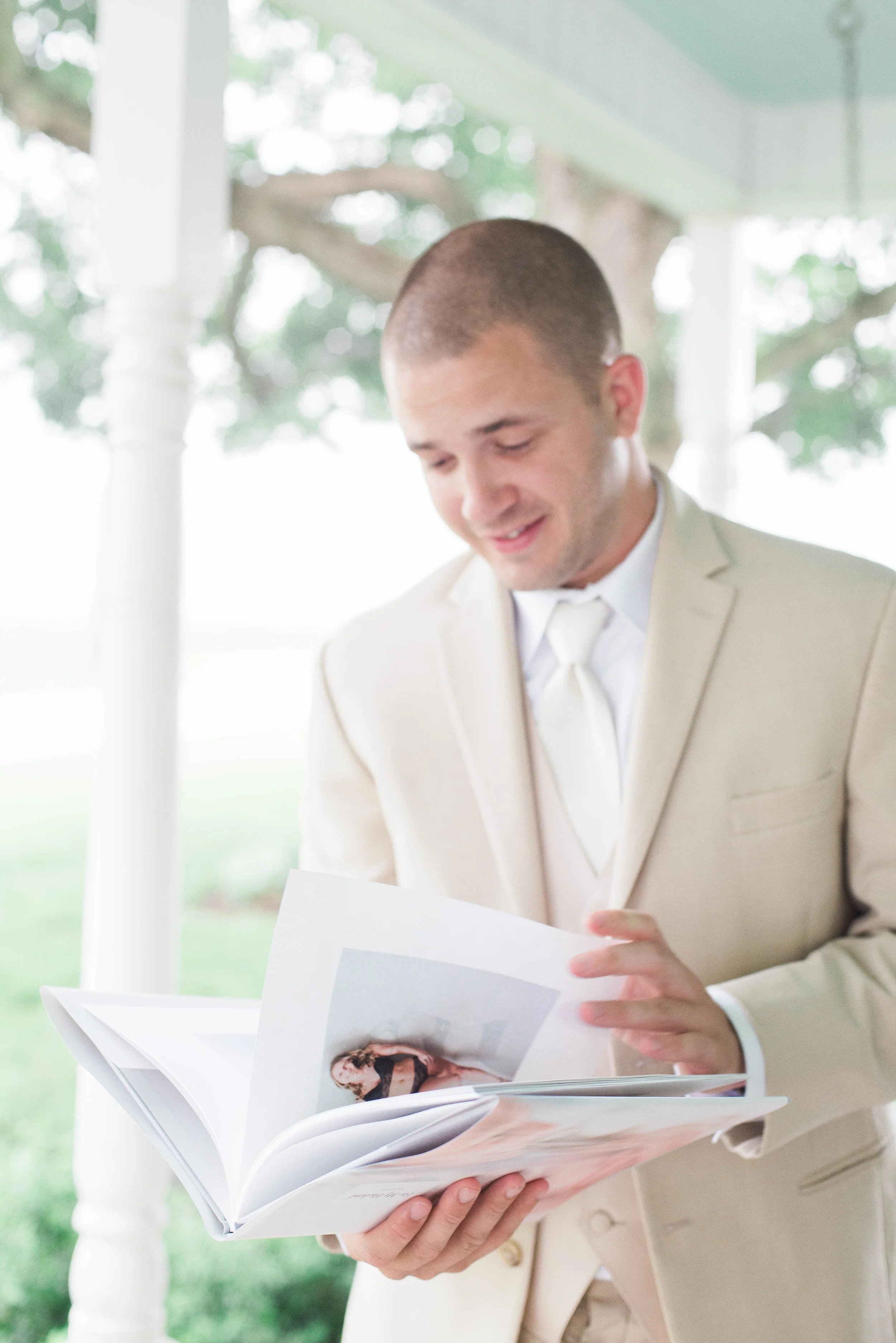 One of our grooms seeing his bride’s special boudoir gift right before the first look on their wedding day! He was over the moon!