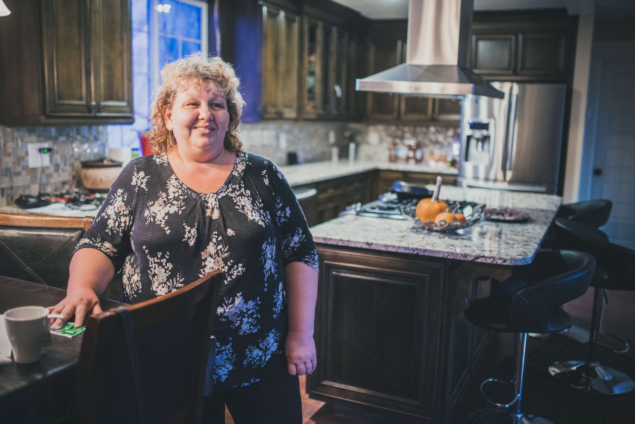 Marina and her family came to Oregon in 2000 as Uzbekistani refugees. They were fleeing violence and religious oppression, and arrived in the US with $200 in their pockets. They struggled to find stable work and housing, but then received a Mercy Corps Northwest IDA grant to purchase a vehicle, which proved to be a turning point for the family. More recently, Marina took a Business Foundation class through MCNW that was offered in Russian--perfect for her as her English isn't strong. She runs a cleaning business, and used the knowledge from the class to streamline her accounting, taxes, and business plans. Her sons work in construction, and this photo was taken in her recently-rennovated kitchen, of which she was very proud. 