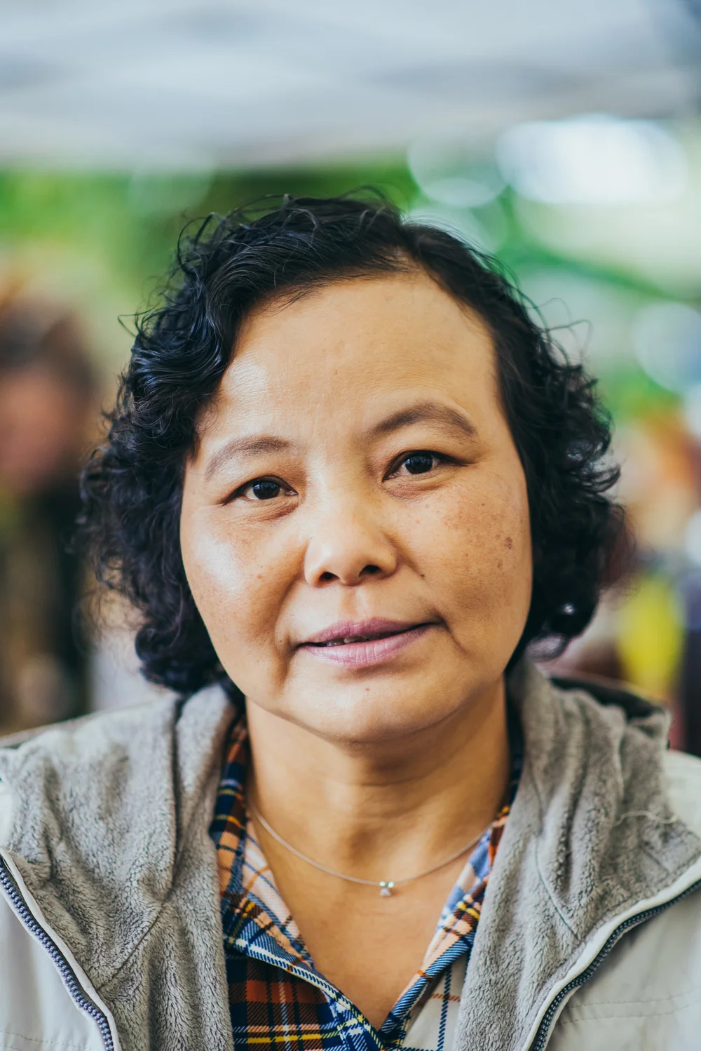 Tee Mu spent the first twenty years of her life in a small village in Myanmar. Then Burmese soldiers began attacking the area, capturing her neighbors, assaulting the women, and burning homes and crops. She and her husband fled to Thailand, where they lived in a refugee camp for the next twenty-five years. Now she lives in Portland, where she has taught herself English and is supporting her children as they progress through school and toward careers. She translates for neighbors when they need help, and often cooks for members of the community. She also works in the gardens, and helps sell produce at the markets, where she enjoys interacting with the customers and vendors. 