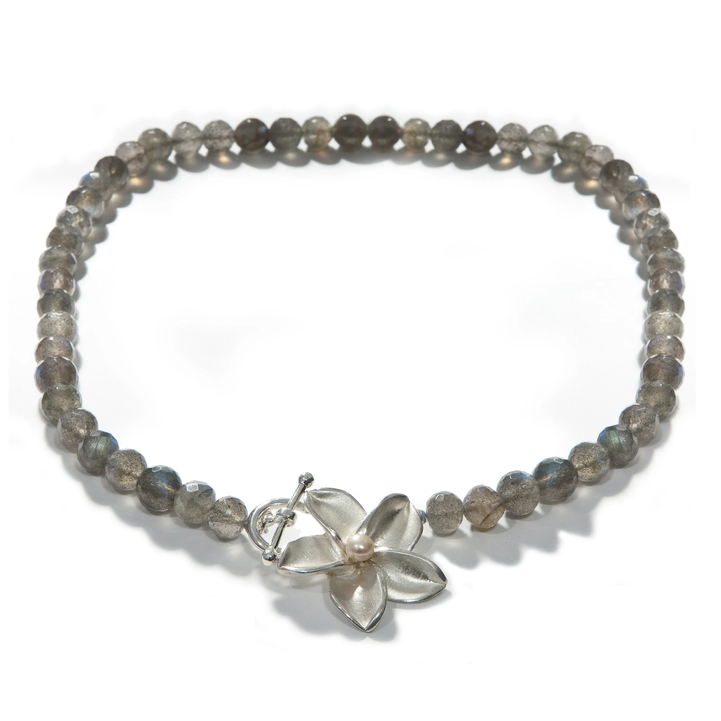 Plumeria on Labradorite.jpeg