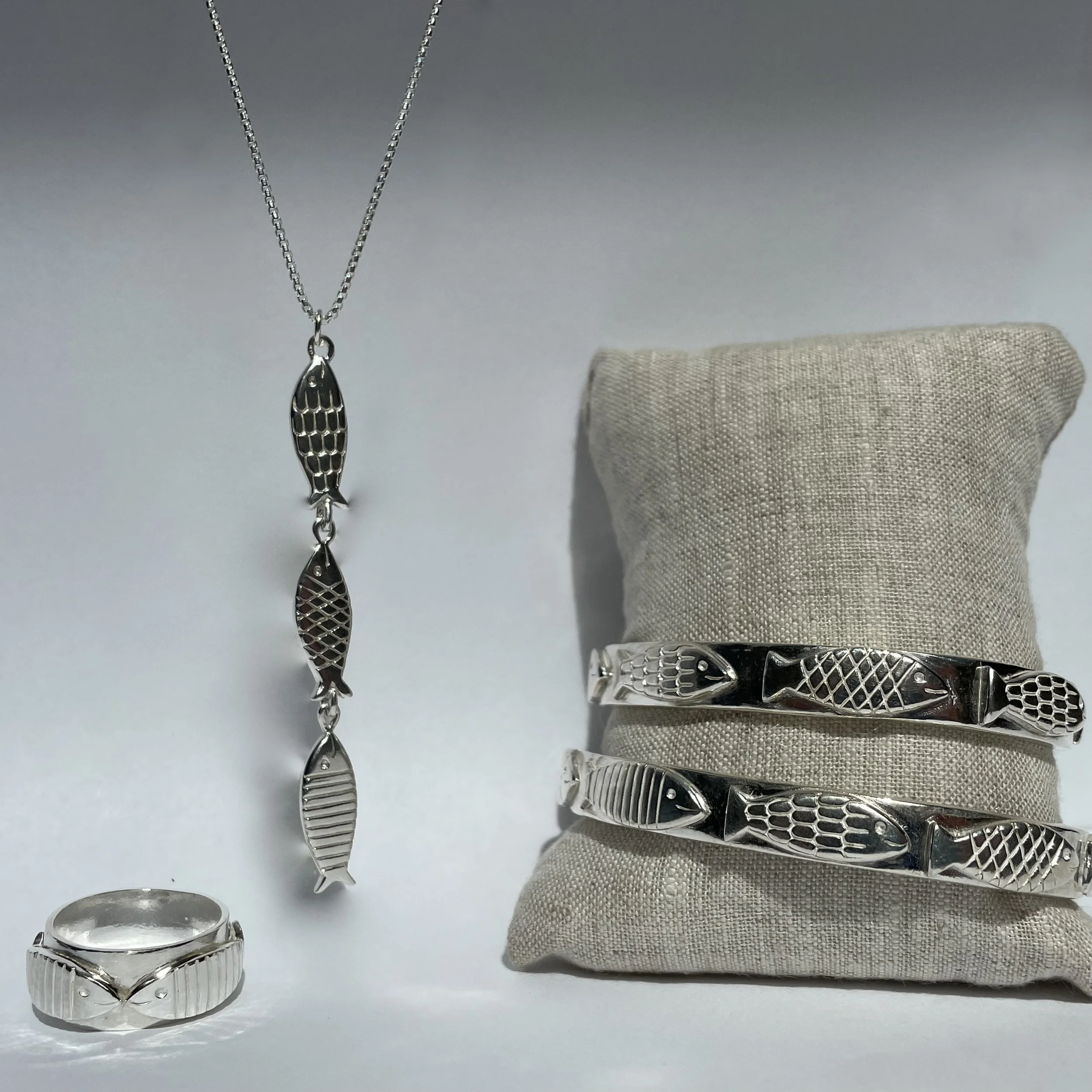Betsy Frost Design's "Daily Catch" Cuffs, Triple Pendant and Kissing Fish Ring     IMG_9845.jpeg