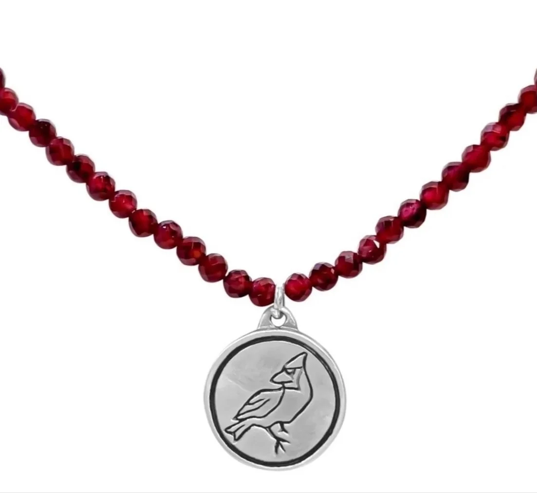The Cardinal Collection. Red garnets look absolutely fantastic on a strand or with French wire earrings. You can also order these designs in sterling silver without the garnets. 
What Does Seeing a Cardinal Mean?
For many bird lovers, the sight of a 