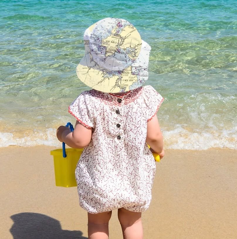 This is just THE SWEETEST! Cape Ann and Ipswich Maritime Baby Bucket Hat
So cute on the little ones at the beach with nautical map design of Cape Ann and Ipswich. Size: 12-24 mos. Purchase on betsyfrostdesign.com under "Ipswich Themed Gifts&quot