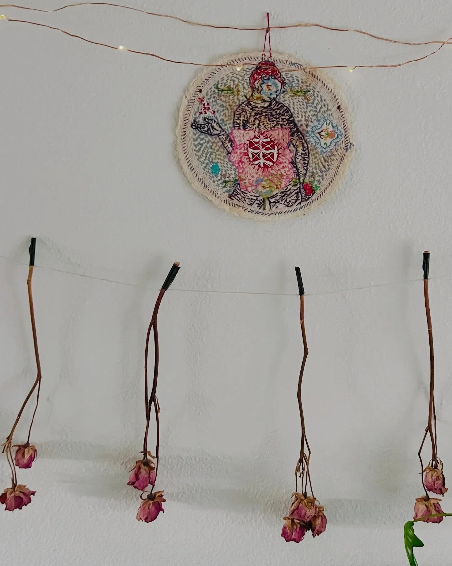 The gift that is my friend @willemien_de_villiers . I continue to be drawn to her #subversivestitch work and also &lsquo;subversive&rsquo;, deeply caring way of being. 
Hanging on my wall, with roses. 
And at another house in CA, many years ago, agai