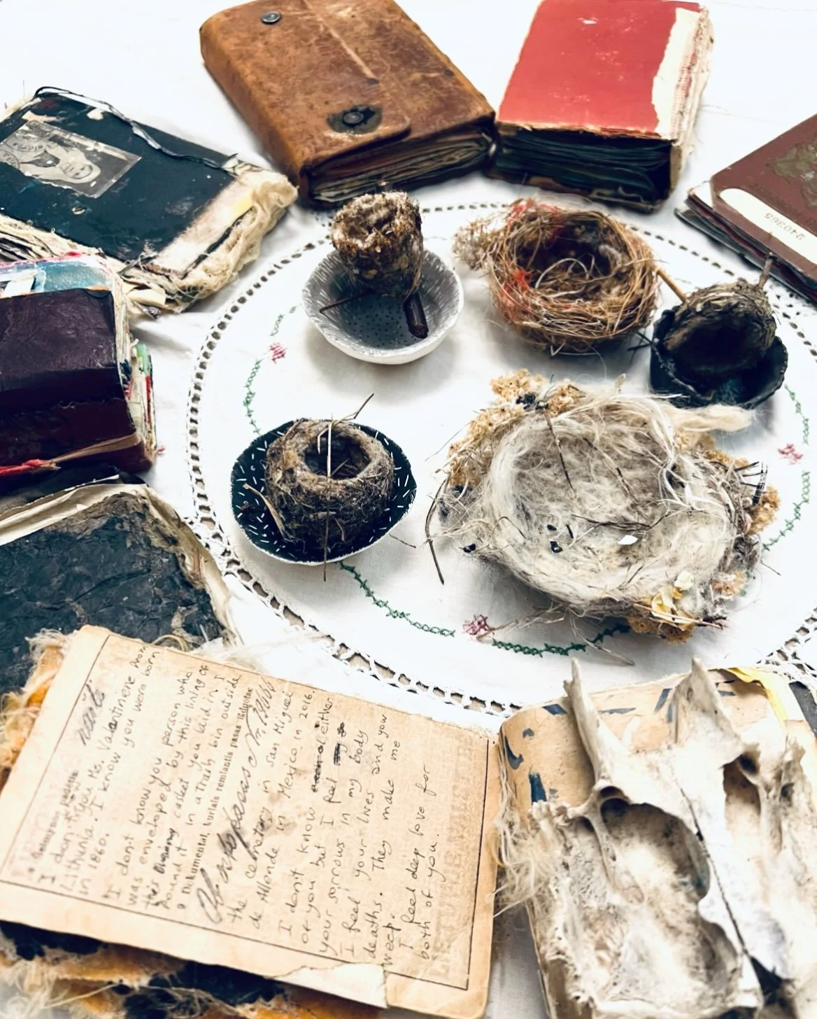 These memorials I build so respectfully and tactily, with my hands, with bones, with cloth, with dents in clay, with twigs, lint, threads, and floaty feathers, on paper, with paint, thin like blood, with pens, marks, lines, scratches and scribbles, a