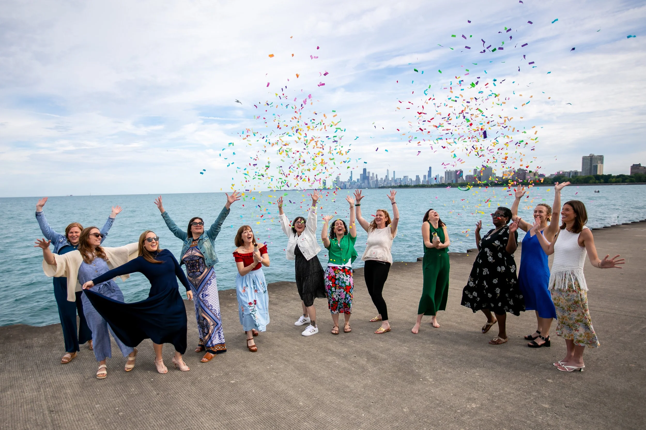the AELO team launches confetti cannons in front of Lake Michigan and the Chicago Skyline