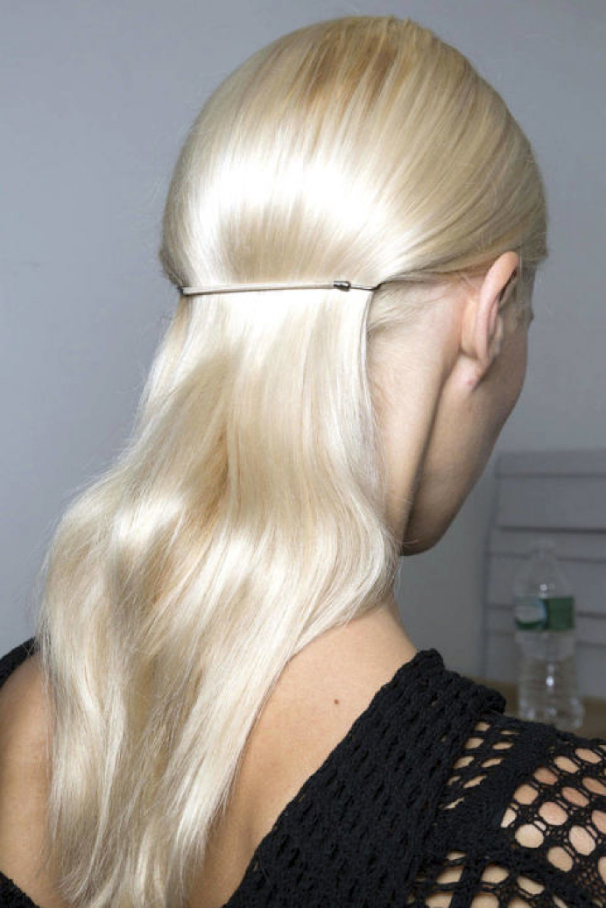 You can find these Hair Bungee's at any good hairdressing supply store, they are the essential hair tie! Blow-dry your hair smooth, once dried take big sections and wind the hair around the barrel of a large curling tong to give the hair a slight bend. Tease the hair at the crown if you fancy a little height up top then smooth some serum through the hair for polish. Section the hair all the way around from ear to ear and gather that hair into a ponytail using two Bungee Bands hooked together, as close to the head as possible. The trick to this look is smoothness to the top and sides and a looser ponytail with movement. Spray the finished look with some shine spray to seal the deal!
