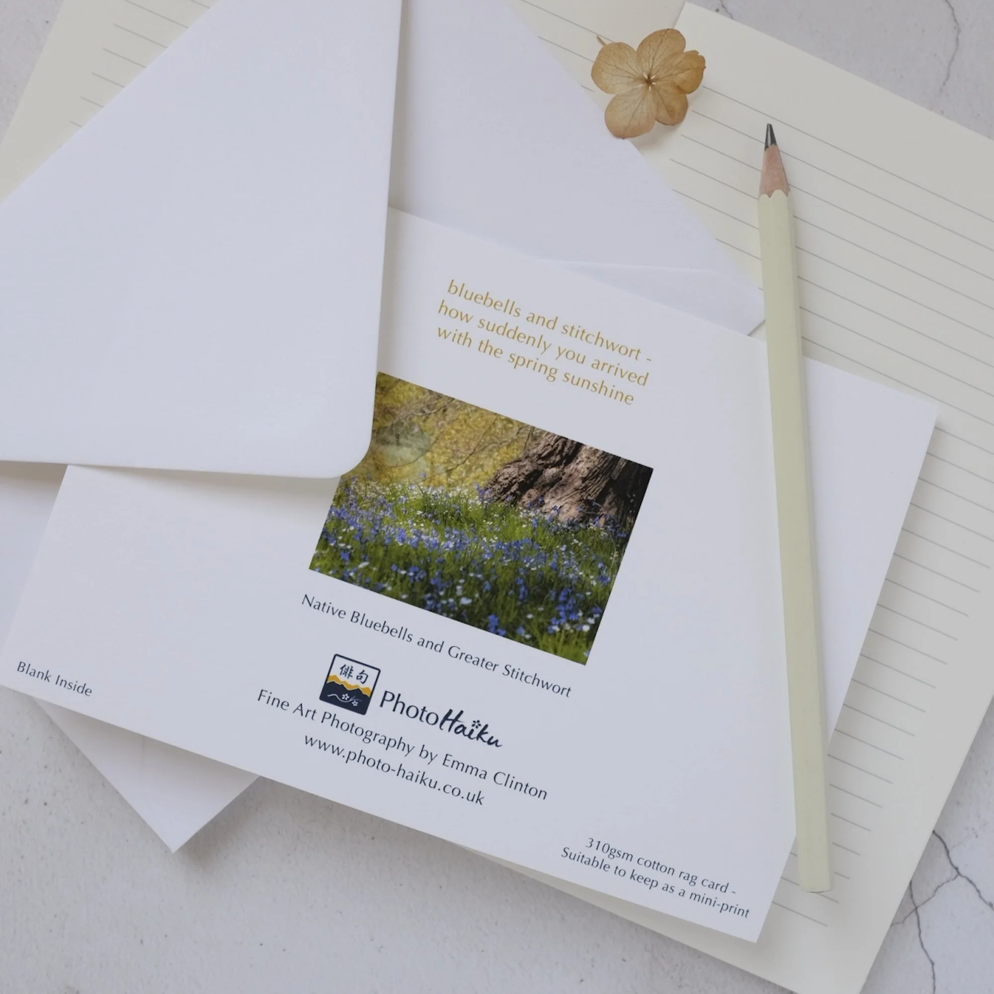 Bluebells beneath a tree luxury card with white envelope.