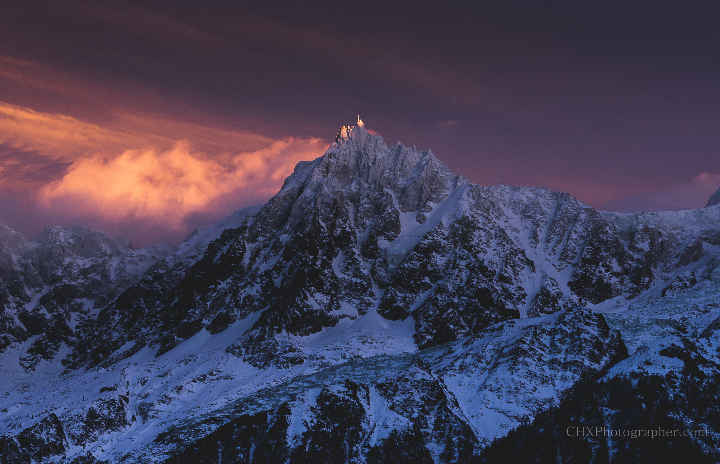 A fiery sunset over the Aiguille du midi in Chamonix, France