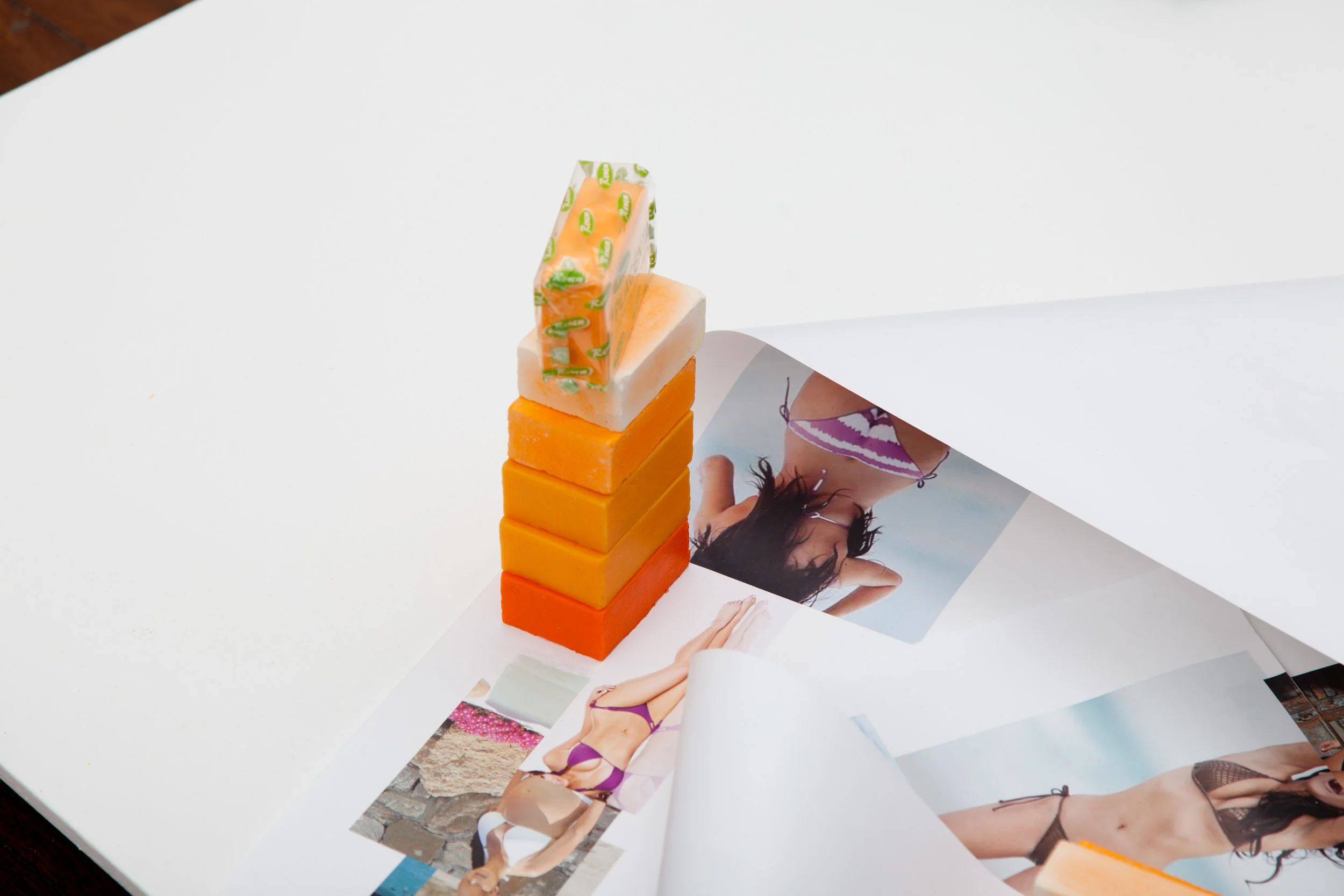 Sunset , 2012, polyurethane expanding foam, pigmented silicone, skin-whitening soap; and Body for days , 2013, found images of Kim Kardashian, repurposed Barbara Kruger text, installation view, Life & Style , 2015, Kudos Gallery, Sydney. Photography: Brett East. Copyright JD Reforma