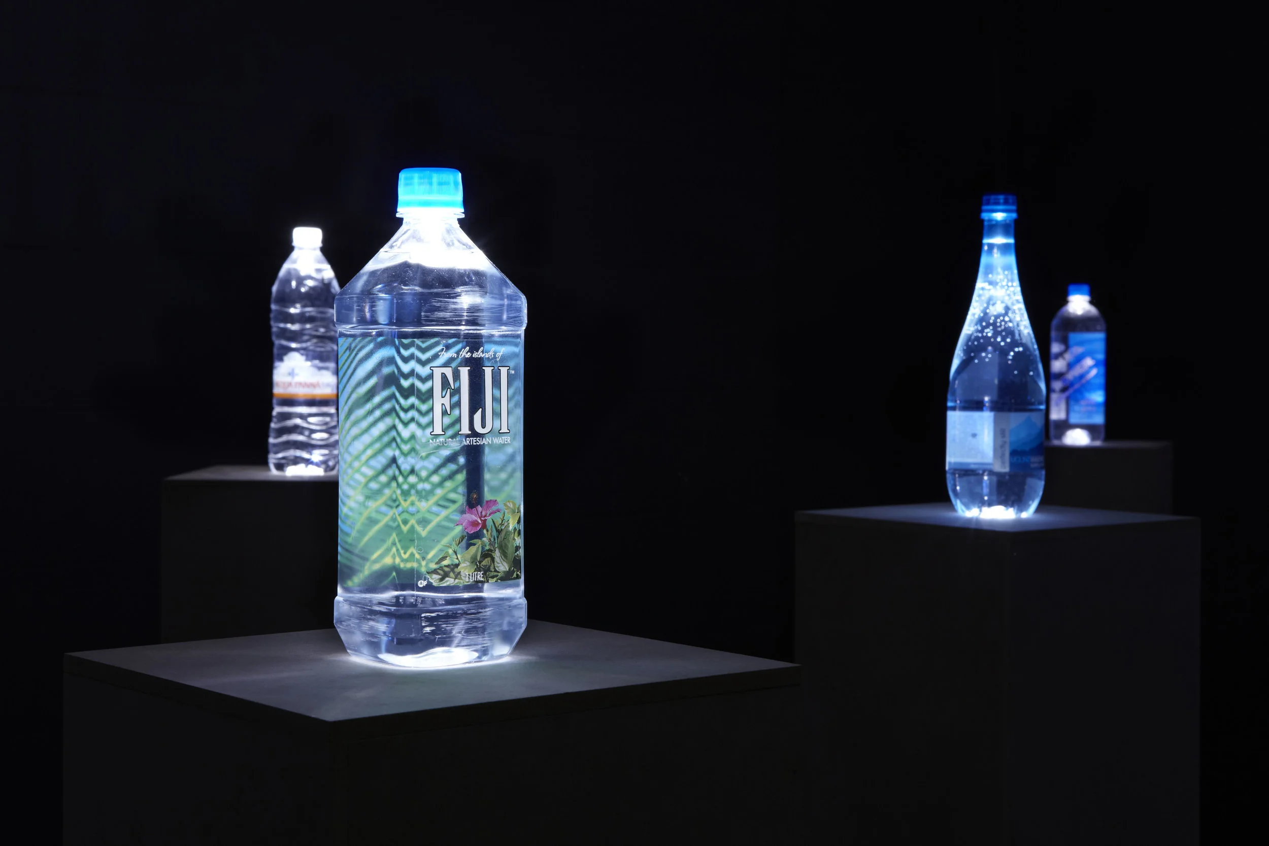 The Source , 2013, 1L spring water bottles, LED lights, custom MDF plinths, installation view, The Source, Mosman Art Gallery, Sydney. Photography: Zan Wimberley. Copyright JD Reforma