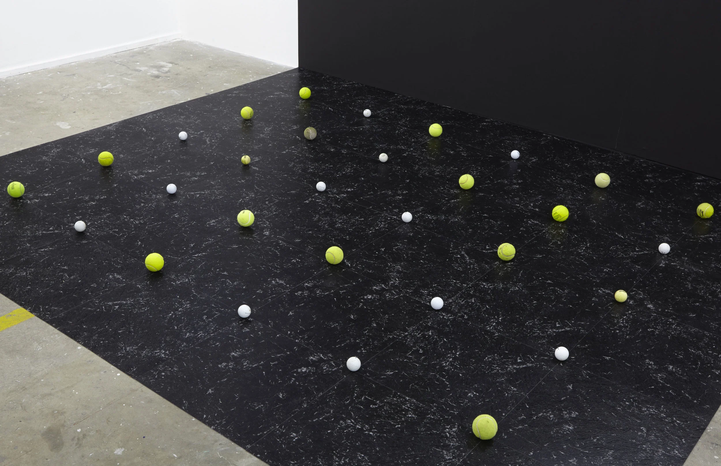 Orbit , 2014, installation of found golf balls and tennis balls, vinyl floor tiles, paint, installation view, THE CLOSED DOOR / THE OPEN DOOR (with Justin Balmain), 2014, Alaska Projects, Sydney. Photo: Zan Wimberley. Copyright JD Reforma