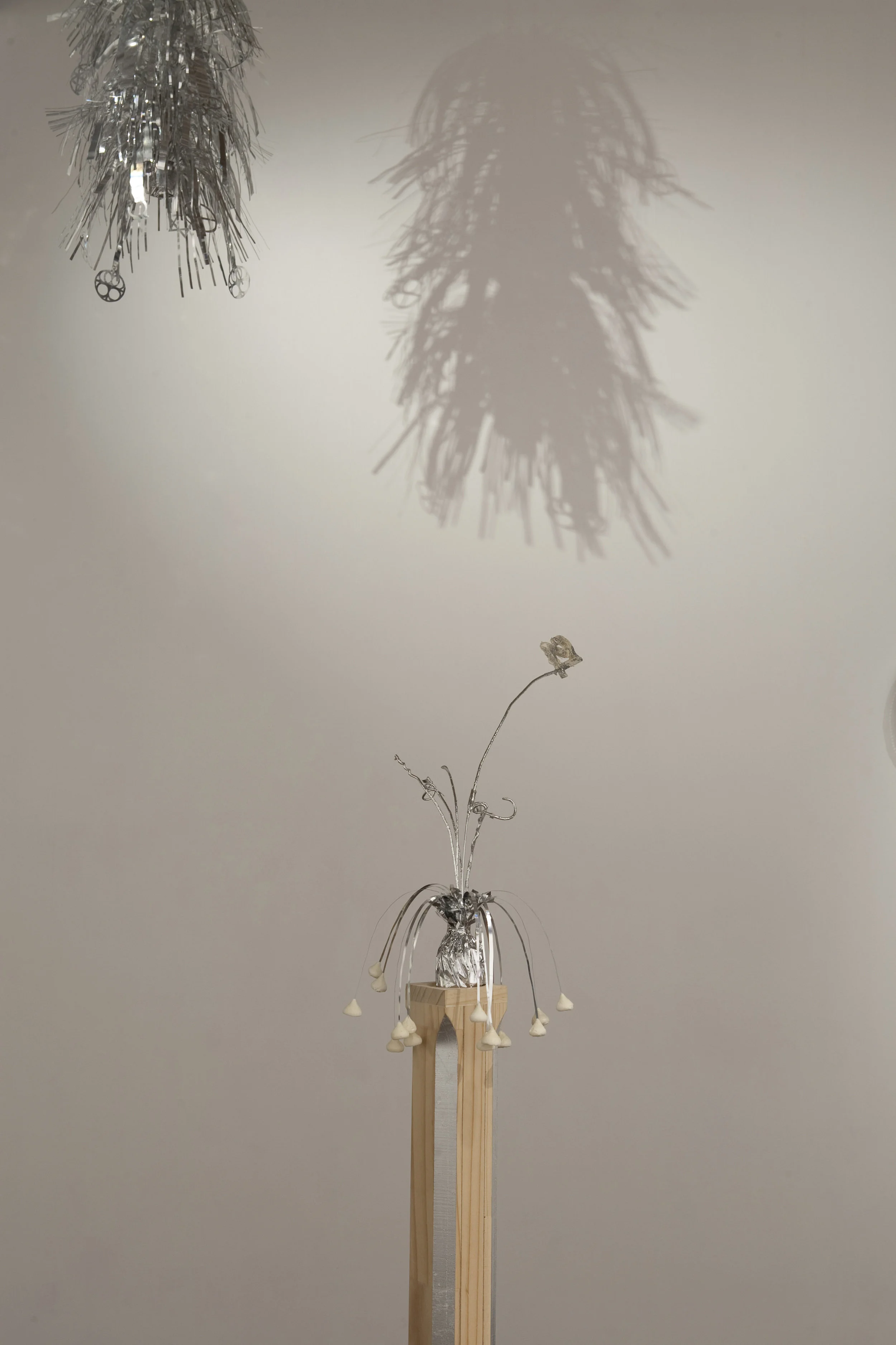 Forever 21 (I) , 2011, modified balloon weight, polyurethane expanding foam, custom DAR pine plinth, silver leaf, detail, M.O.M. (Muse of Manila) , 2011, Firstdraft, Sydney. Photo: Charles Dennington. Copyright JD Reforma