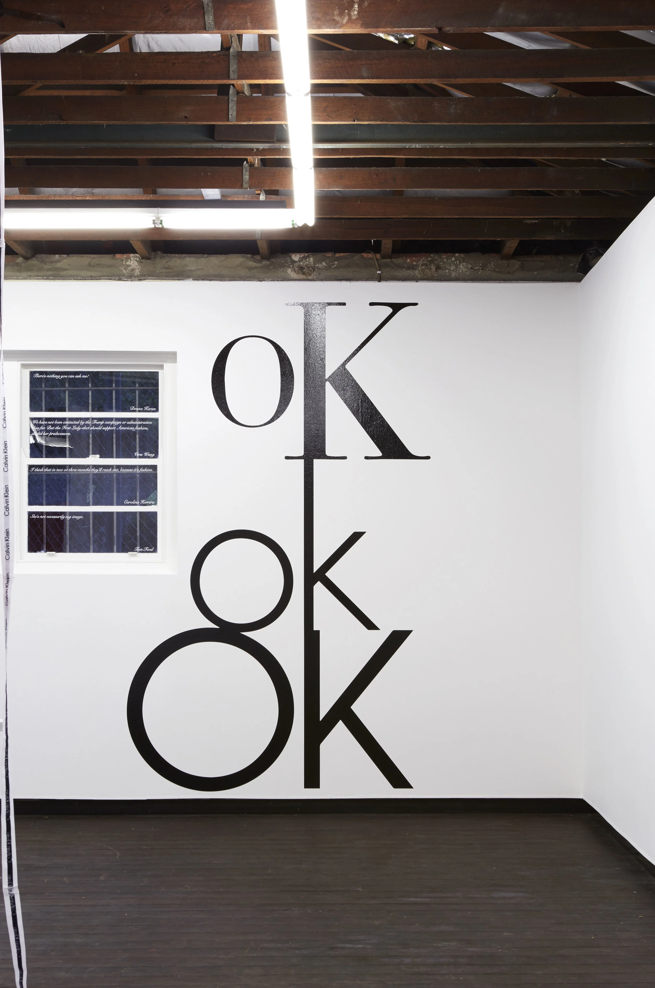 oK ok OK , 2017, site-specific computer-cut vinyl, altered Calvin Klein logos, installation view, Coconut Republic , Firstdraft, Sydney. Photo: Zan Wimberley. Copyright JD Reforma