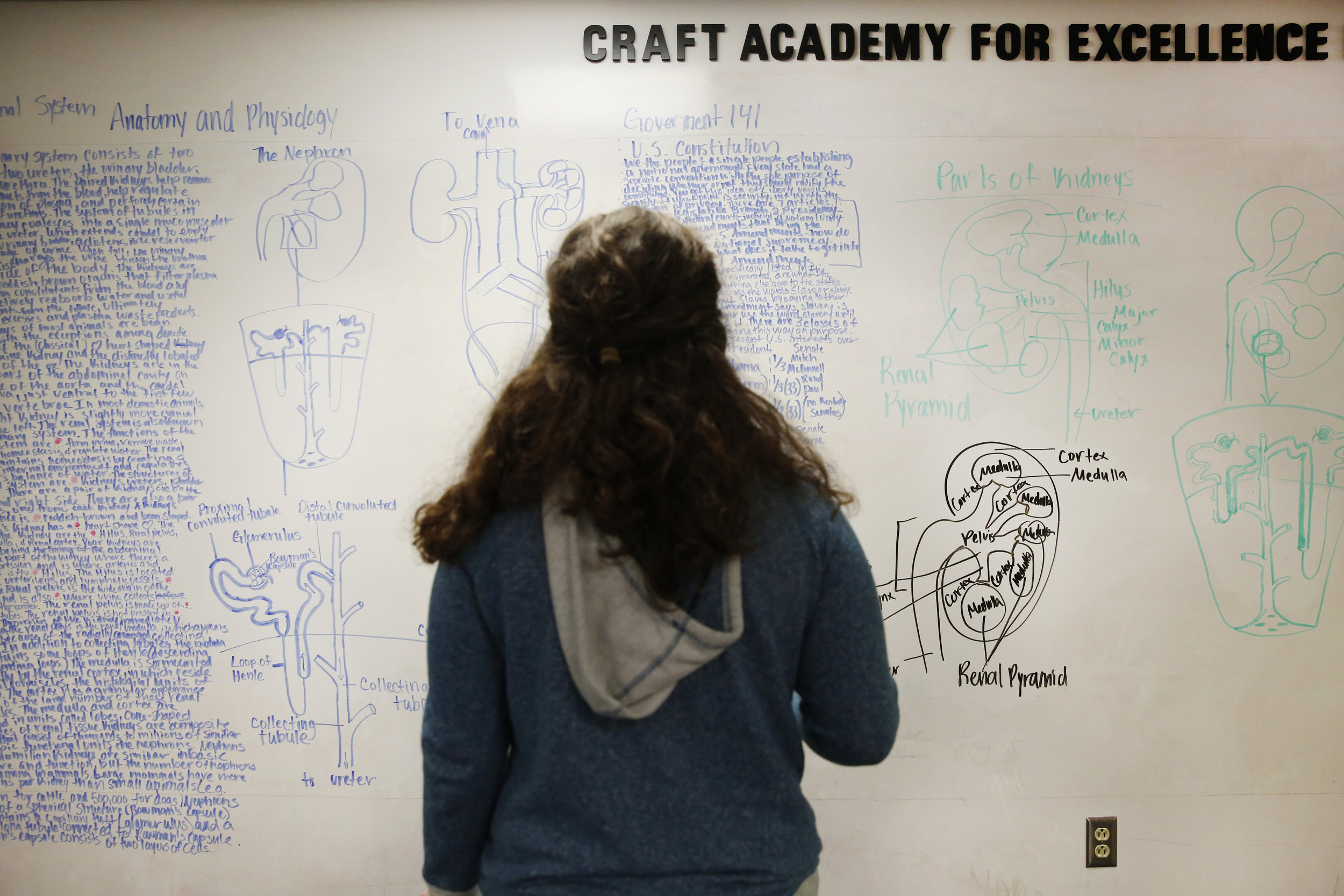  Minutes before curfew, Grace studies the notes and diagrams she drew on a whiteboard in preparation for a government midterm and anatomy quiz. &nbsp; 