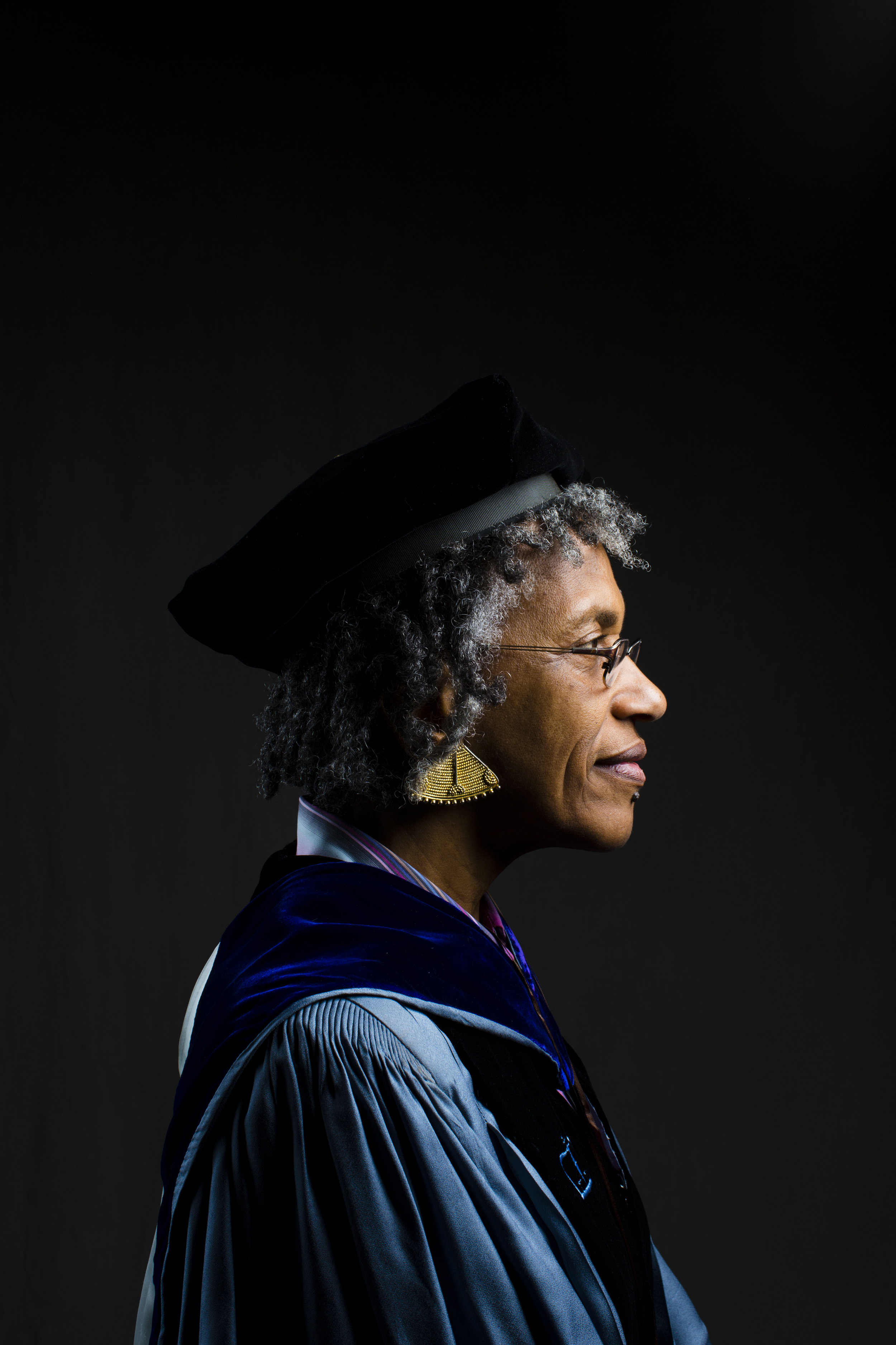  Associate Professor of Political Science Pearl Robinson is shown in the light-blue robe and gold tassels of Columbia University, where she earned her PhD. She has worn them to every Tufts graduation for the past forty years. “My gown has grown old w