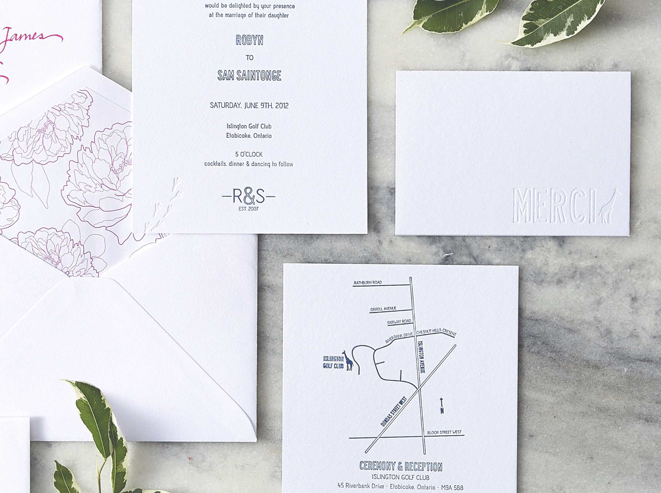 Details, including custom peony print envelope liners and blind embossed thank you cards.