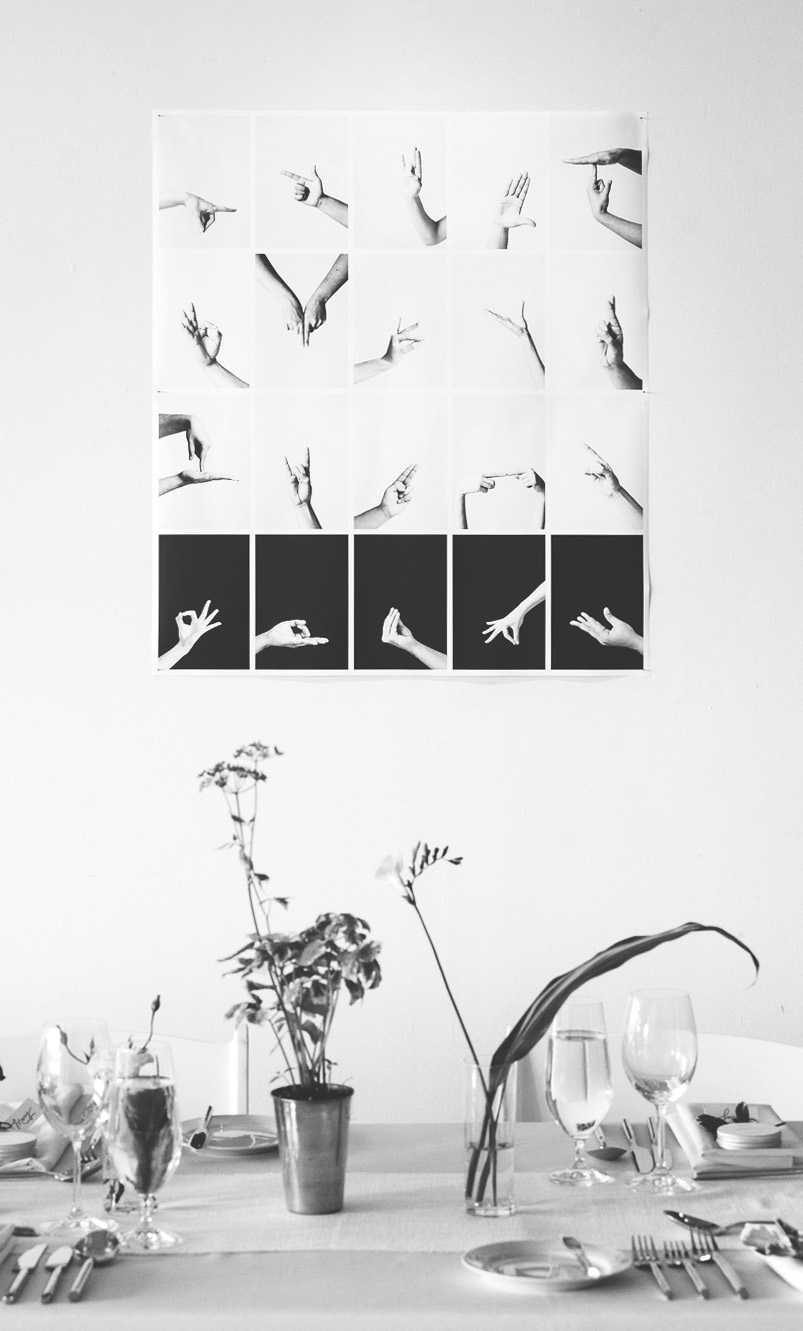 An oversized black and white photo montage was created to incorporate the Indian and Italian hand gesture photos in to the space, as introduced in the wedding invitations.