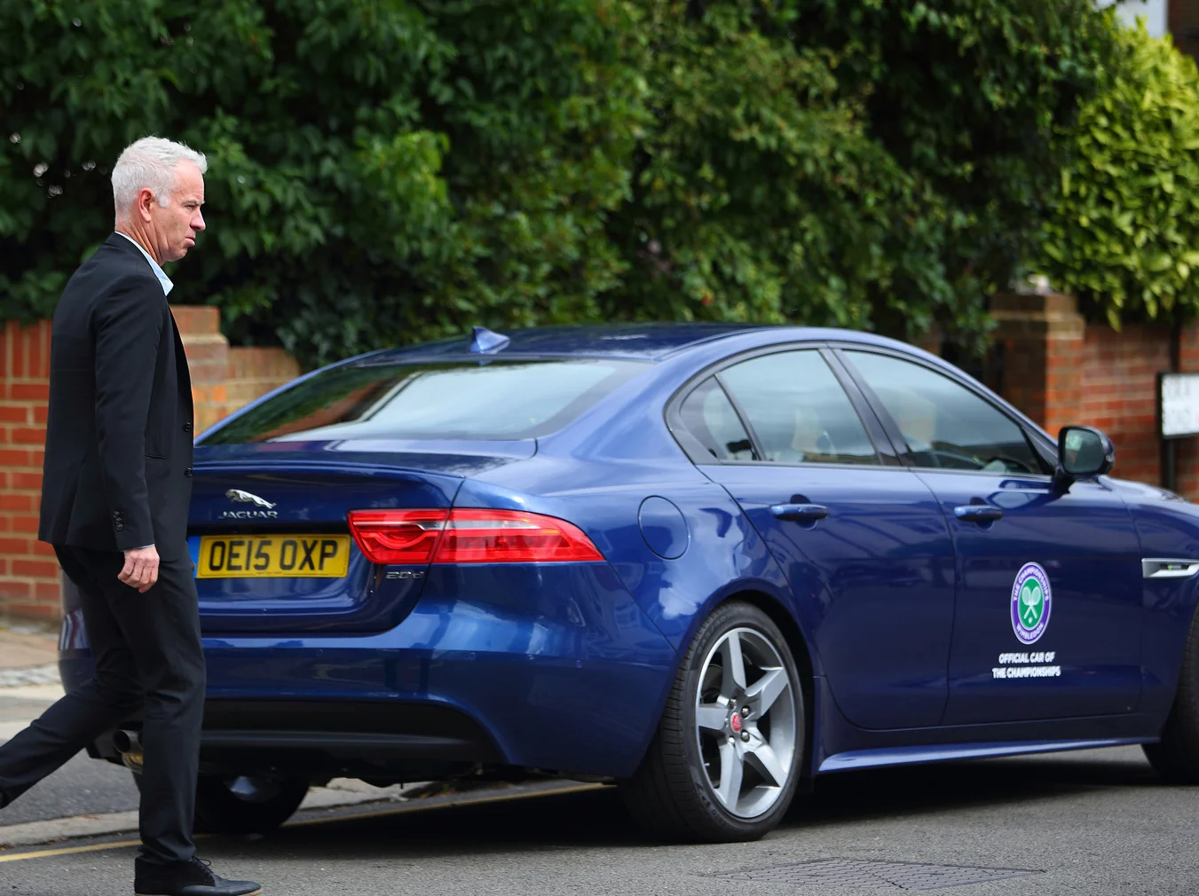 John McEnroe Chauffeurs Wimbledon fans in Jaguar XE