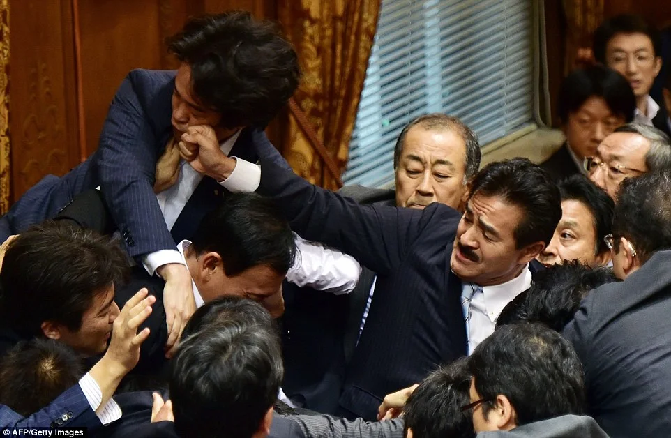 Japan Military Bills Provoke Scuffling in Parliament