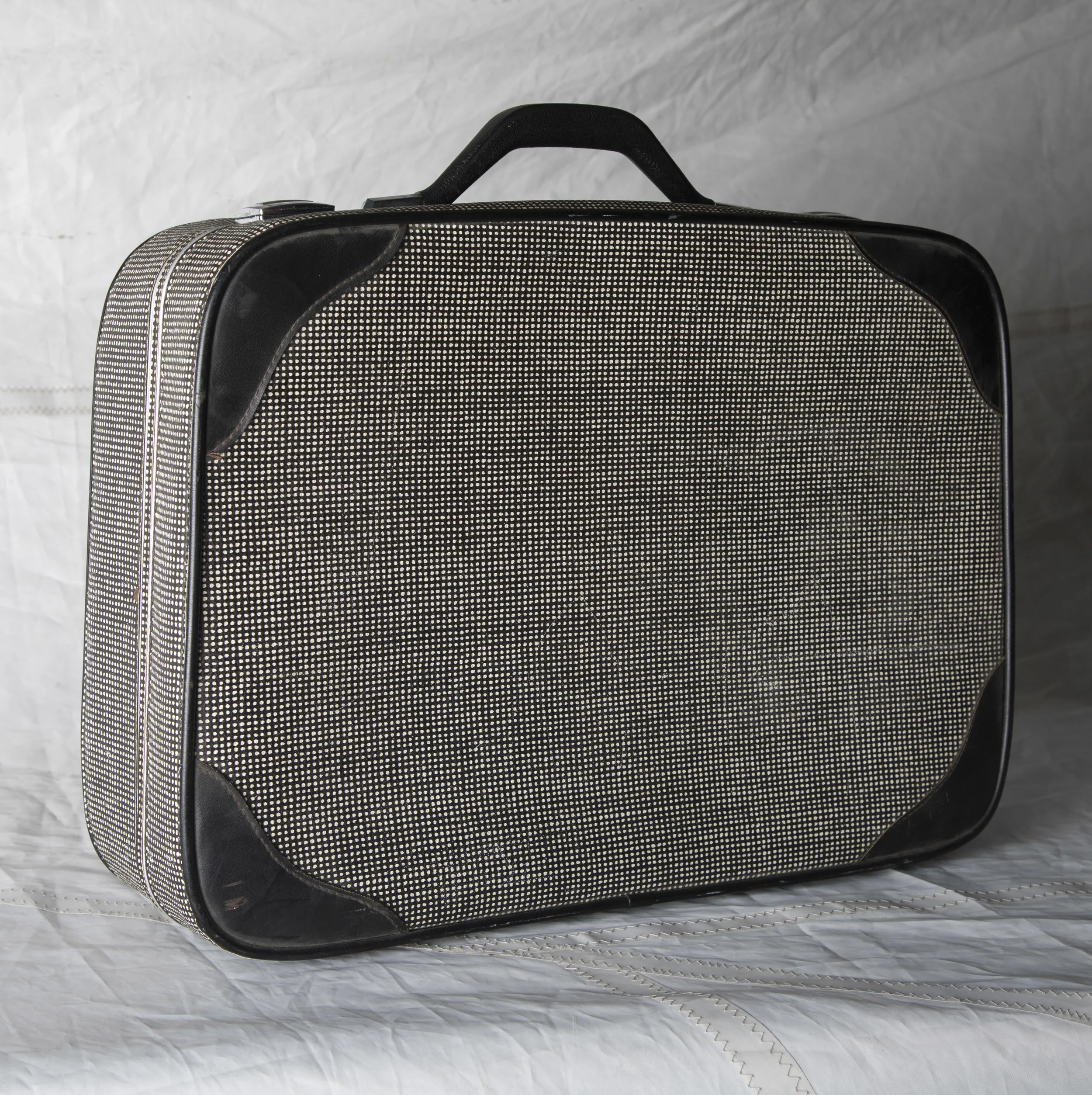 LUGGAGE 05 BLACK W/ WHITE MOIRE SUITCASE, CIRCA 1960 21" L x 16" W x 6" D