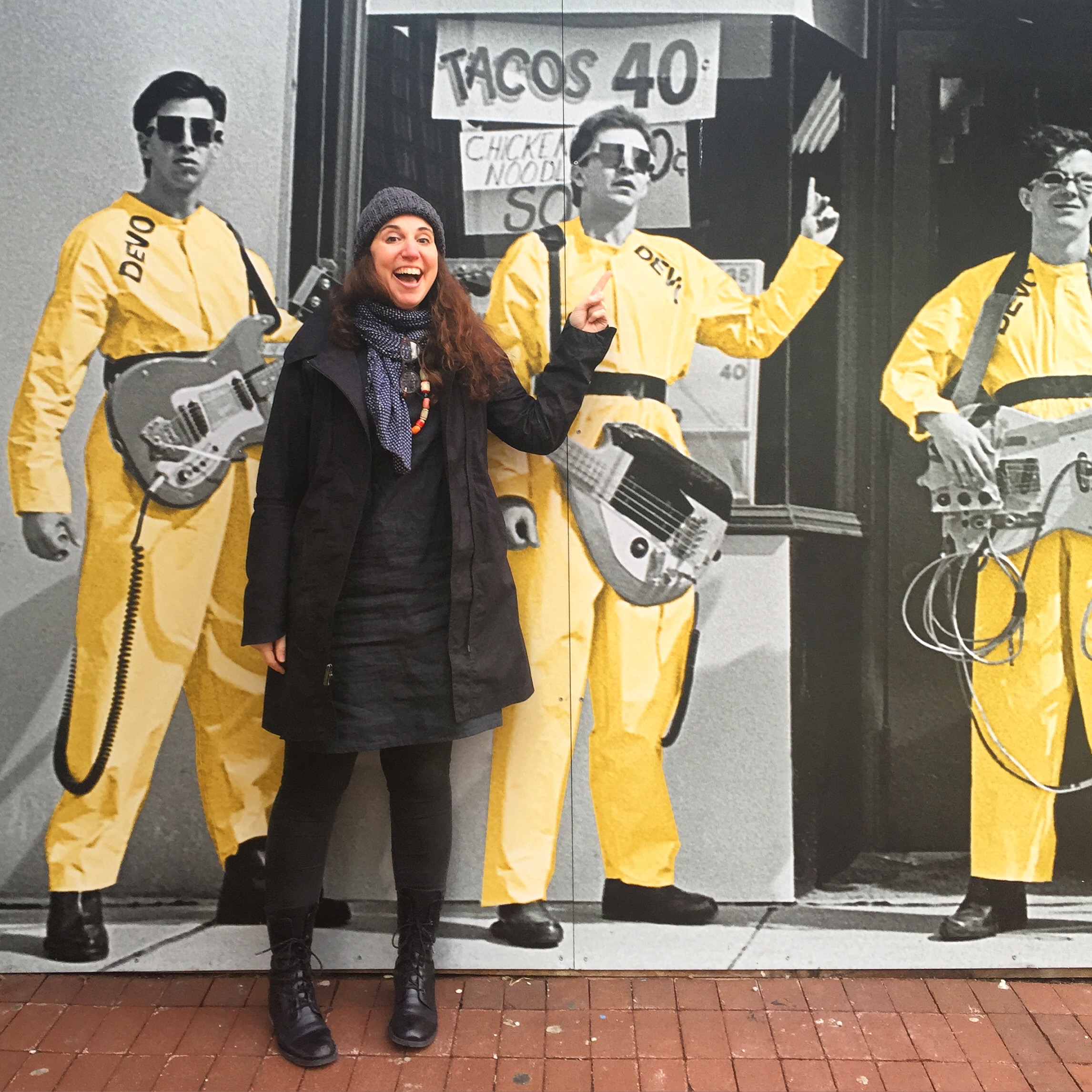 Have zines will travel: I love visiting universities to speak and work with students. (Here I am on a recent trip to the University of Akron completely nerding out with the DEVO mural downtown.) I have presented my work in an expansive set of contexts including contemporary art galleries, alternative artist spaces, colleges and universities, the lectern at creative conferences worldwide, book stores and stuff shops, and the walls of the offices of select creative companies.