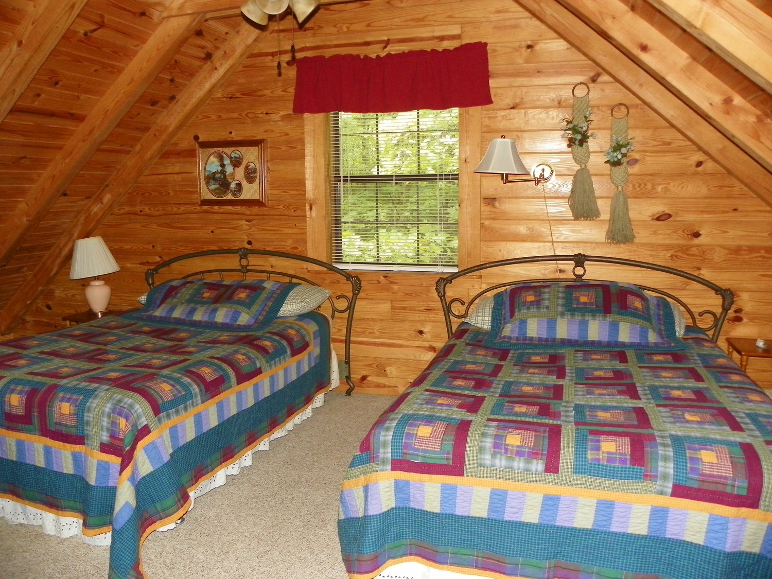 cabin bedroom with two full beds