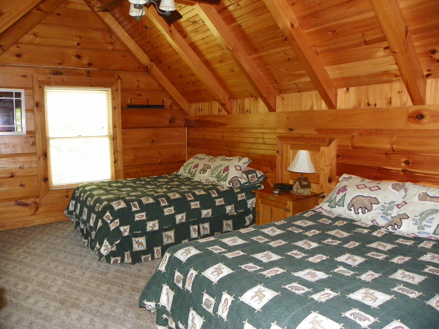 Two queen beds inside Laurel Cove cabin