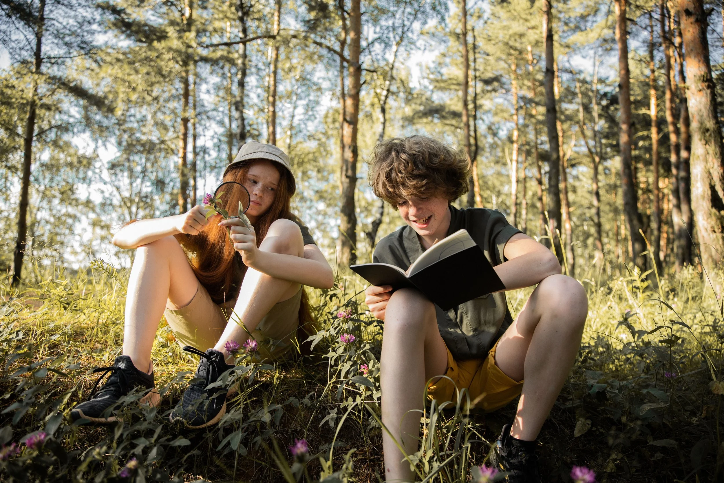 Two homeschool kids exploring nature's classroom
