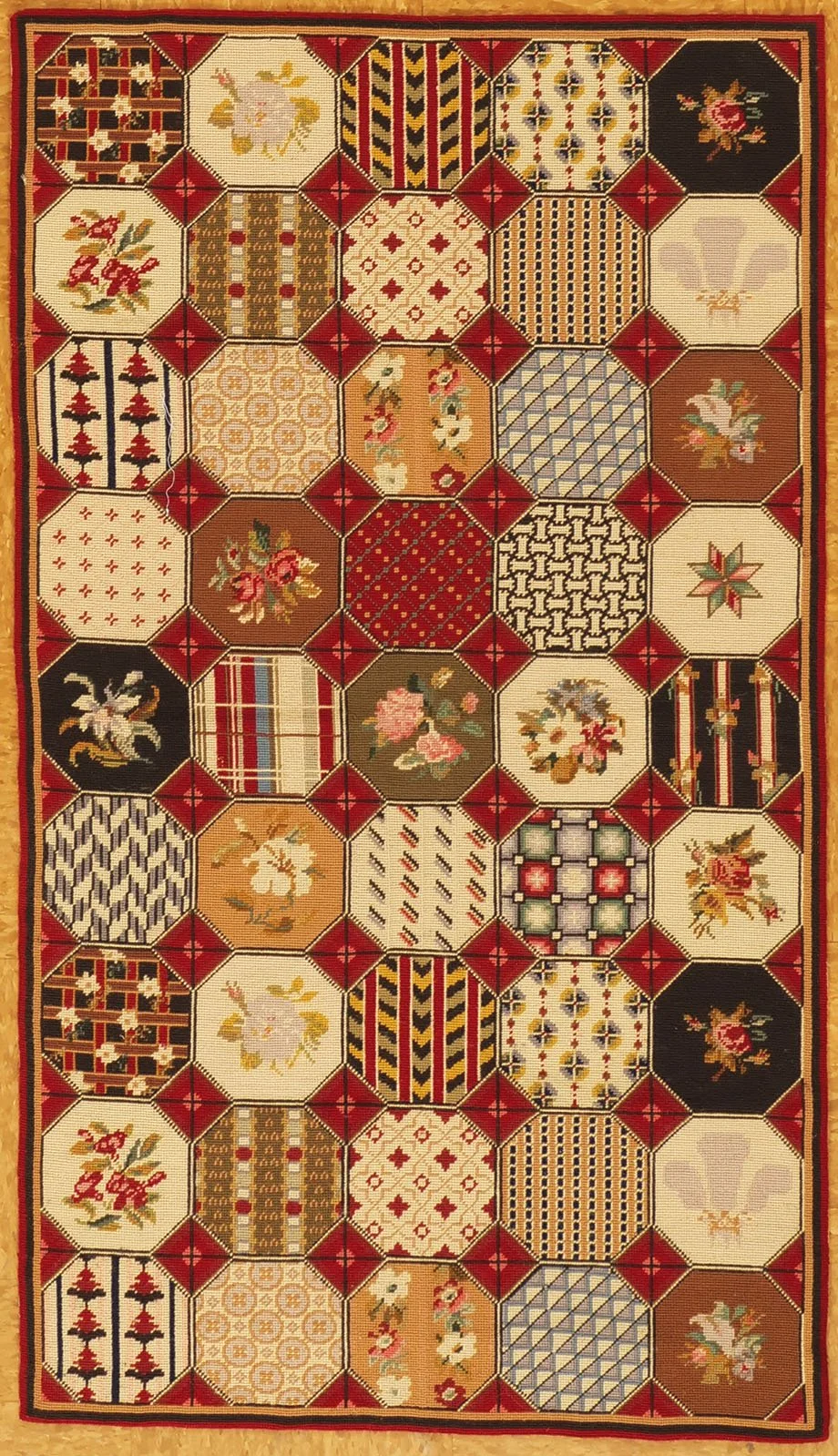 Needlepoint rug with patchwork design