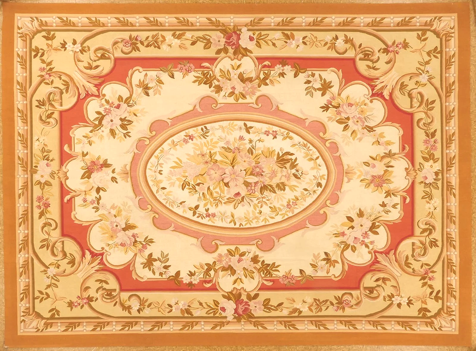 Handwoven aubusson carpet with medallion in red and green tones