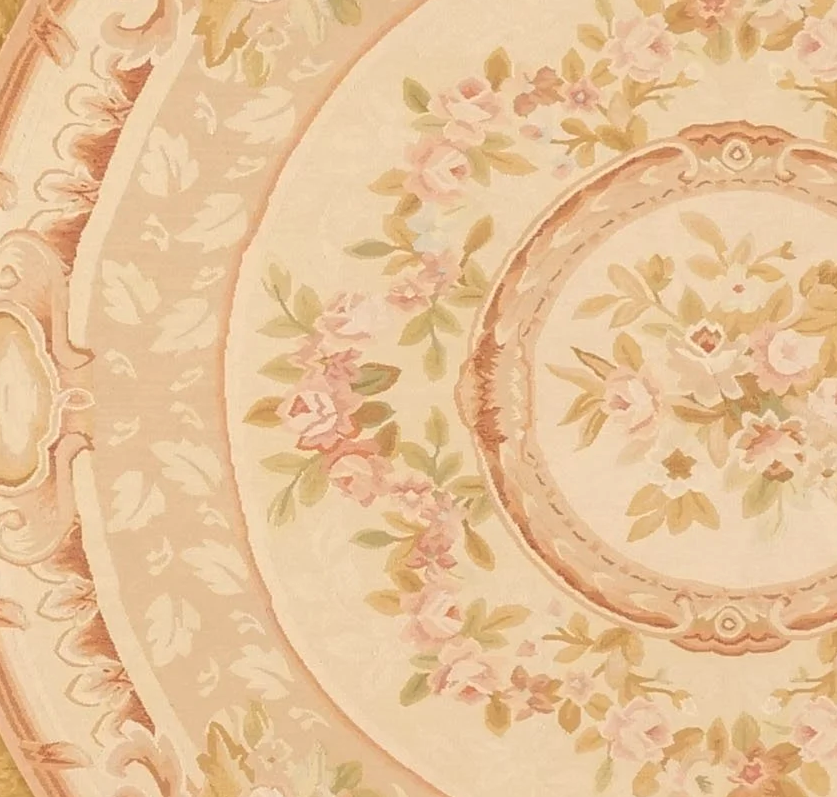 new handwoven round aubusson rug in pastel colors.